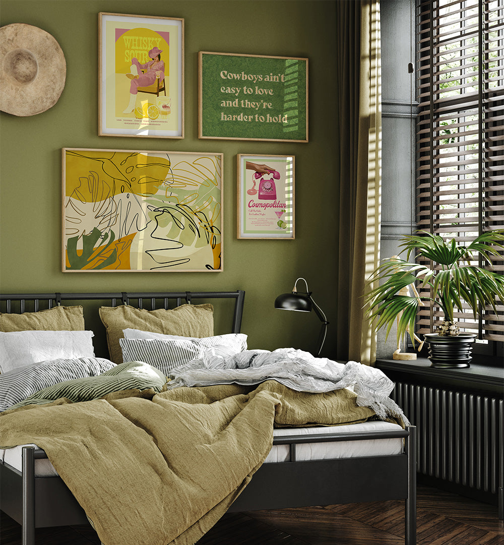 Bedroom with green walls, framed artwork, and a bed with striped bedding.