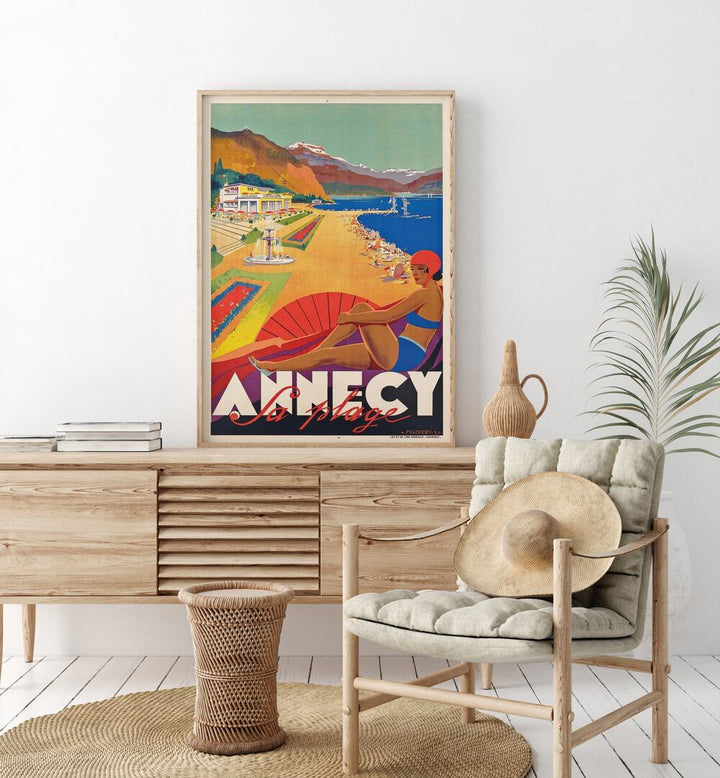 Fa Plage-Anncy Retro Vintage Travel Travel Posters in Oak Wood Plain Frame on a console table beside a plant