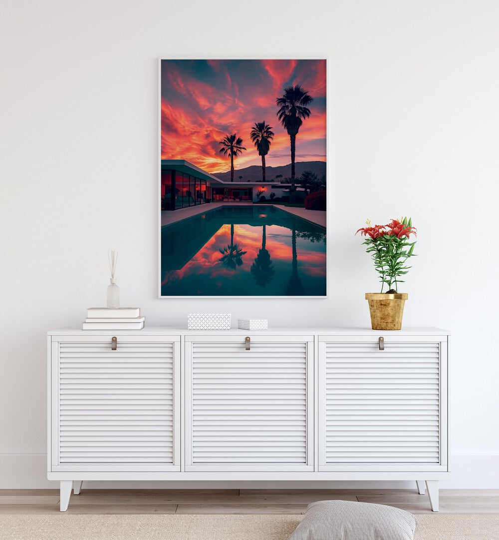 "FALLING OF THE NIGHT, BEACH PAINTINGS showcases a stunning sunset with palm trees reflecting in tranquil water."
