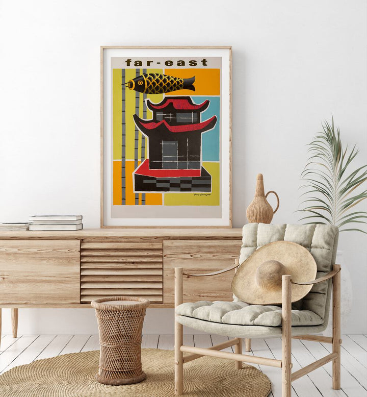 Far East  Travel Posters in Oak Wood Frame With Mount placed on a console table behind a chair