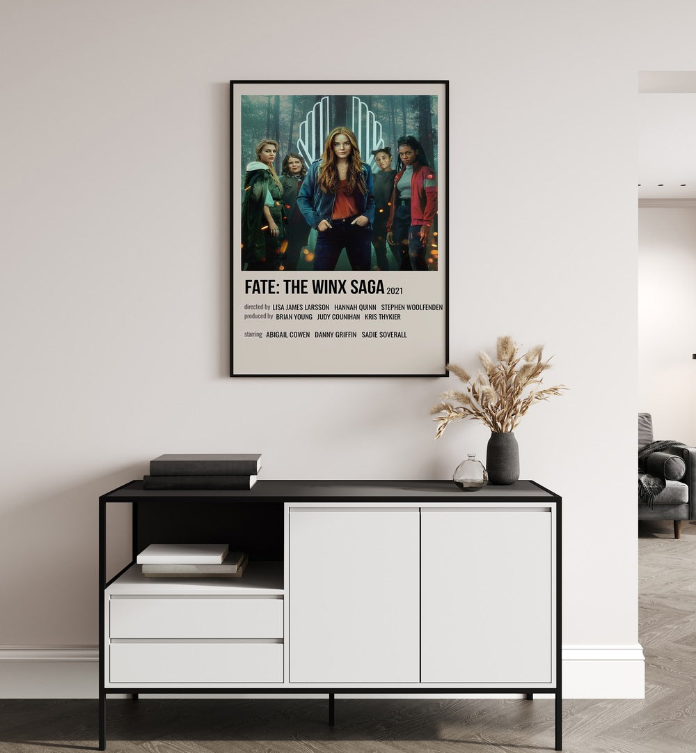 Fate-The Winx Saga 2021 Movie Posters in Black Plain Frame placed on a white wall behind a black and white table