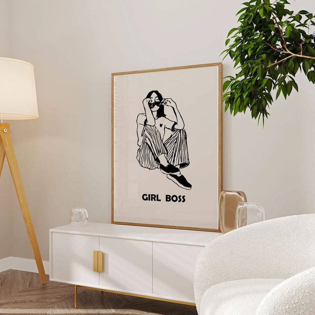 Femme Force Manifesto  Women Illustrations paintings in Oak Wood Plain Frame placed on white console table beside a sofa and a lamp