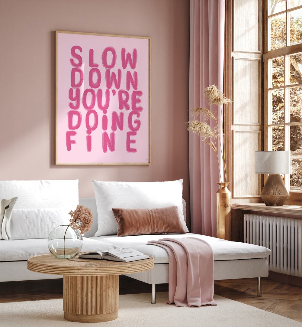 Fine by Anne-marie Volfova Quotes and Typography Posters in Oak Wood Plain Frame placed on a living room wall behind a sofa and beside a window