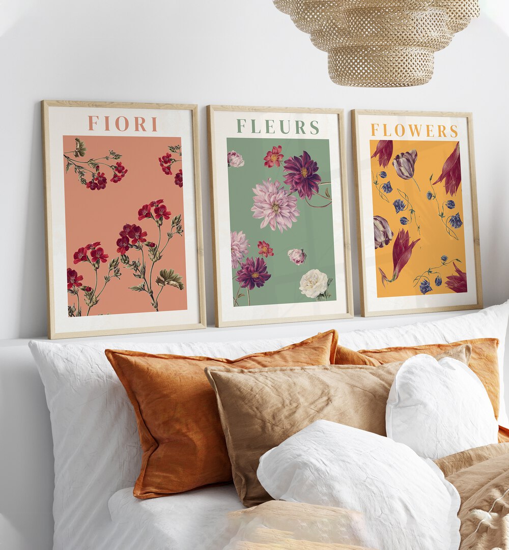 Fiori Set Set Of 3 Paintings in Oak Wood Plain Frame placed behind a bed in a bedroom