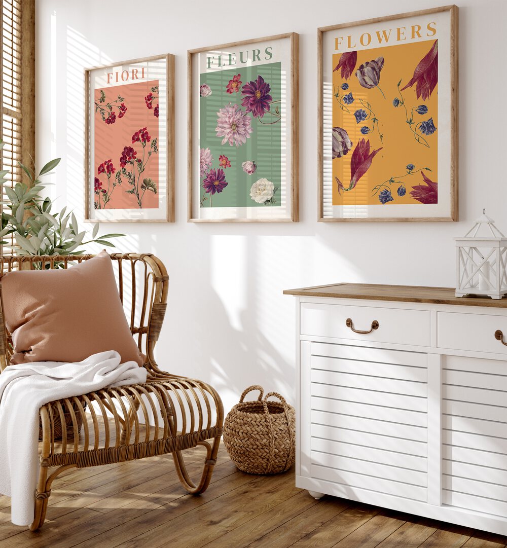 Fiori Set Set Of 3 Paintings in Oak Wood Plain Frame placed on a wall behind a chair and console table