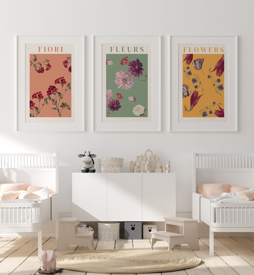 Fiori Set Set Of 3 Paintings in White Frame With Mount placed on a wall behind a infants bed for kids room