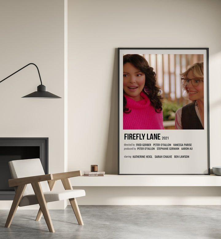 Firefly Lane 2021 Movie Posters in Black Plain Frame placed on a shelf beside a hearth