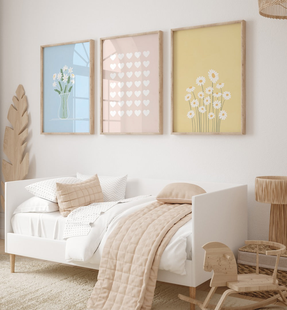 Flower Silhouettes Set Of 3 Paintings in Oak Wood Plain Frame placed on a wall behind a bed