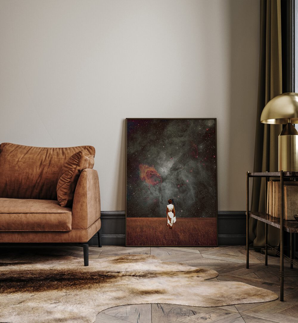 Follow Me By Frank Moth Surreal Art Prints Surrealism in Black Plain Frame placed on the floor beside a sofa