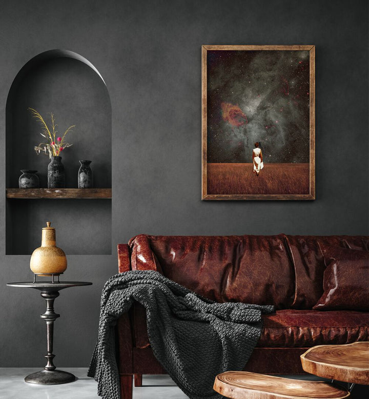 Follow Me By Frank Moth Surreal Art Prints Surrealism in Dark Wood Plain Frame placed on a wall behind a red sofa