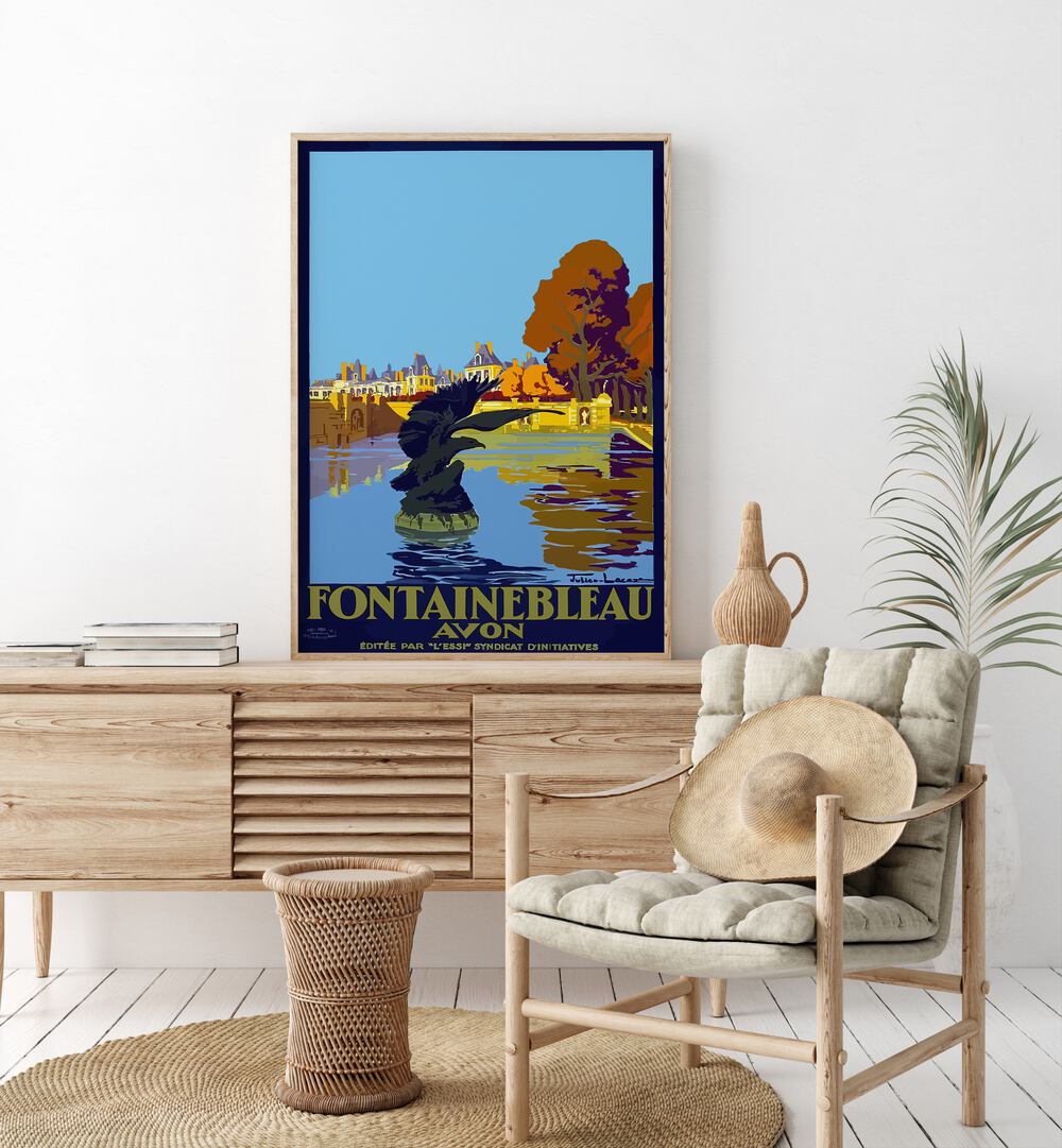 Fontainebleau-Avon Retro Vintage Travel Travel Posters in Oak Wood Plain Frame on a console table beside a plant