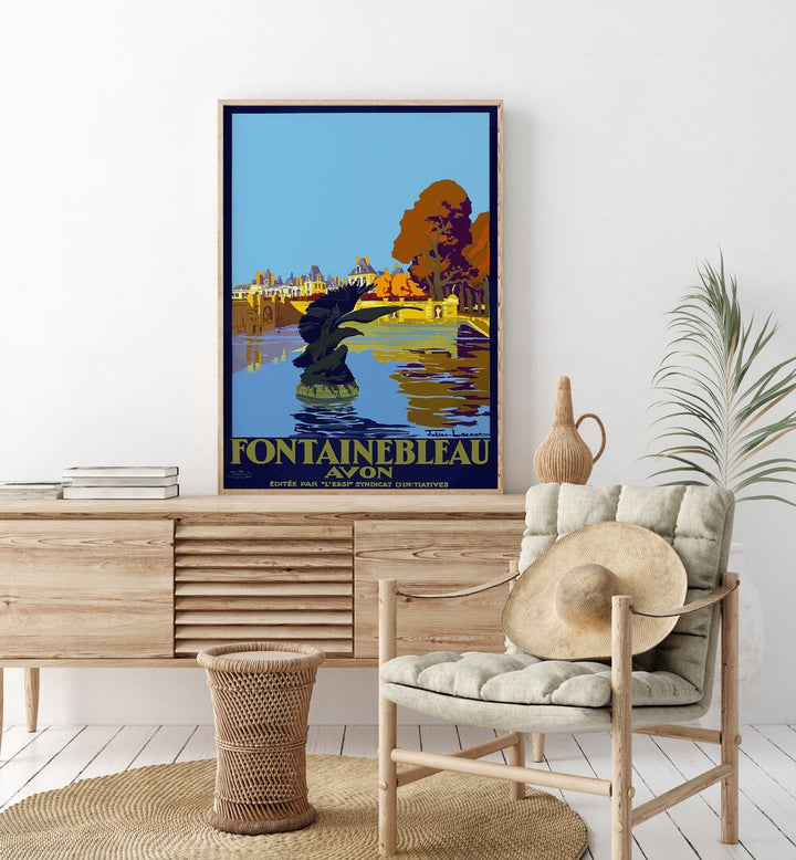 Fontainebleau-Avon Retro Vintage Travel Travel Posters in Oak Wood Plain Frame on a console table beside a plant