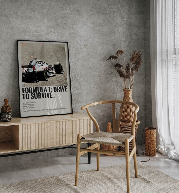 Formula 1-Drive To Survive 2019 Movie Posters in Black Plain Frame placed on a console behind a chair