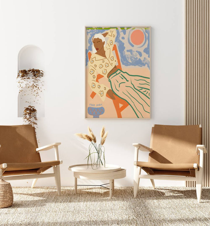 Free Spirit By Uma Gokhale Woman Illustration Paintings in Oak Wood Plain Frame on a white wall behind chairs