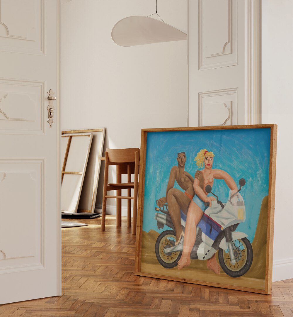 Free Wheel By Cepe Wallart Prints in Oak Wood Plain Frame placed on the floor beside a door