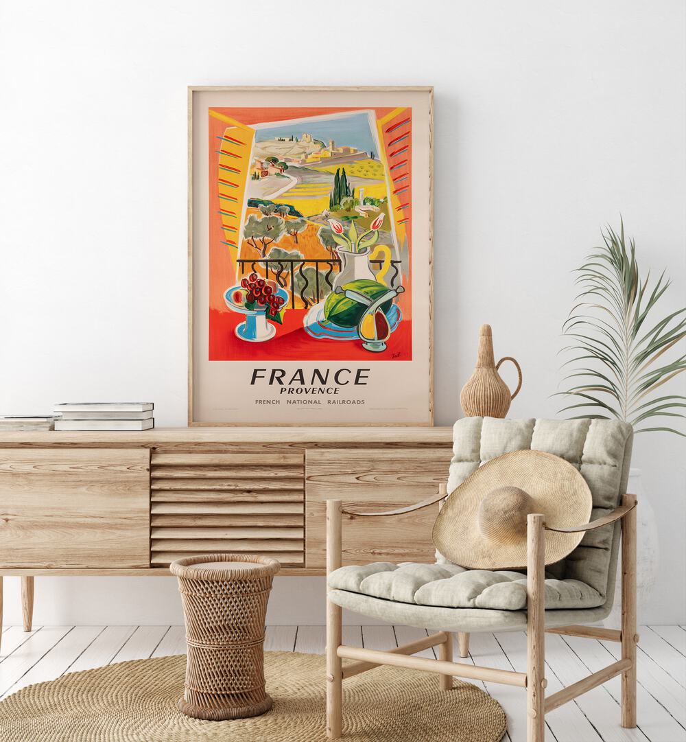 French National Railways  Retro Travel Posters in Oak Wood Plain Frame placed on a console table behind a chair