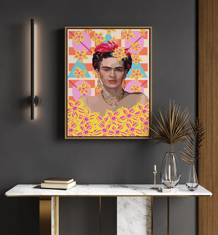 Frida With Flowers By Lynnda Rakos Pop Art Paintings Pop Art Prints in Oak Wood Floater Frame placed on a wall behind a table