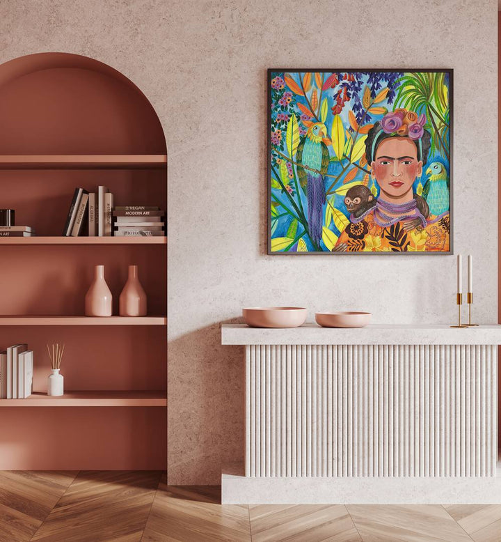 Frida and Her Parrots By Caroline Bonne Muller Woman Illustration Paintings in Black Plain Frame on a pink wall above  a table