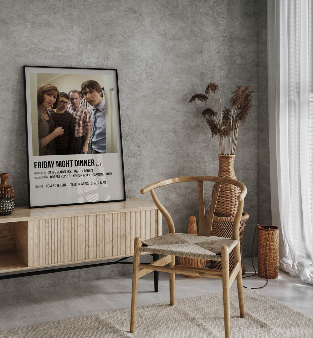 Friday Night Dinner 2011 Movie Posters in Black Plain Frame placed on a console behind a chair