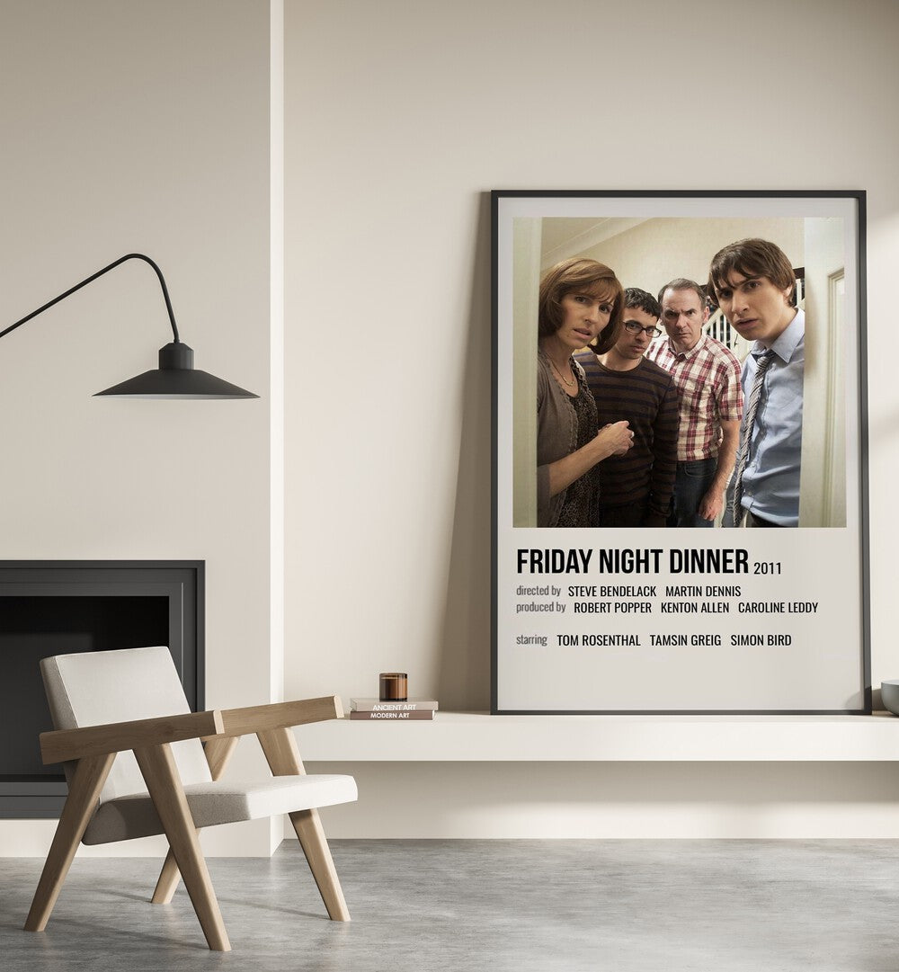 Friday Night Dinner 2011 Movie Posters in Black Plain Frame placed on a shelf beside a hearth
