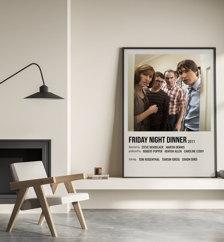 Friday Night Dinner 2011 Movie Posters in Black Plain Frame placed on a shelf beside a hearth