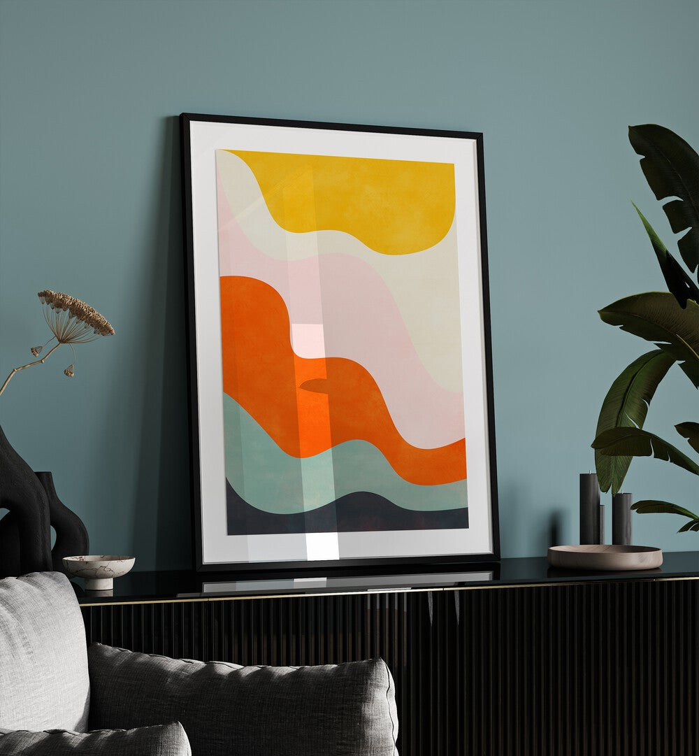 Friendly Colors III By Ana Rut Bre Landscape Art Prints in Black Frame With Mount placed on a Console Table near a Blue Colored Wall 