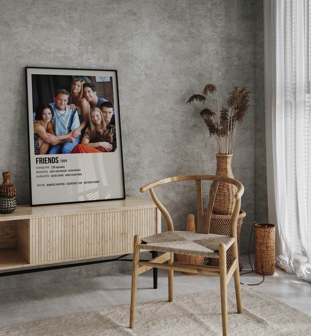 Friends 1994 II Movie Posters in Black Plain Frame placed on a console behind a chair