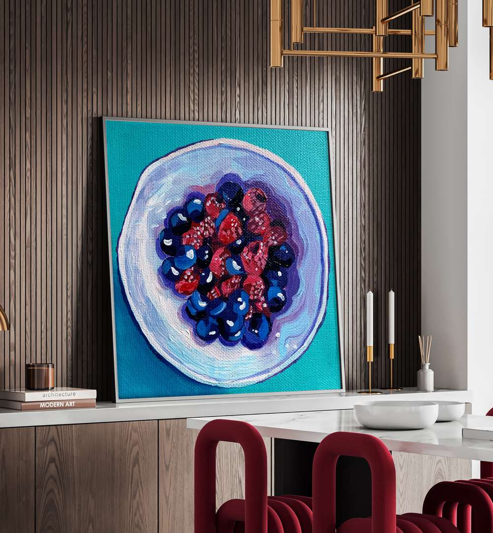 Fruit Bowl By Key And Sea Creative Bar and Cafe Artwork in Black Plain Frame on console table behind a dining table