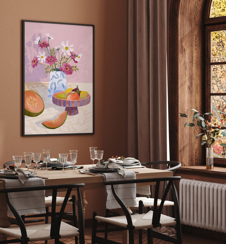 Fruit Break By Goed Blauw Kitchen Art Prints in Black Plain Frame placed on a Brown Colored Wall near a Dining Table in the Dining Room