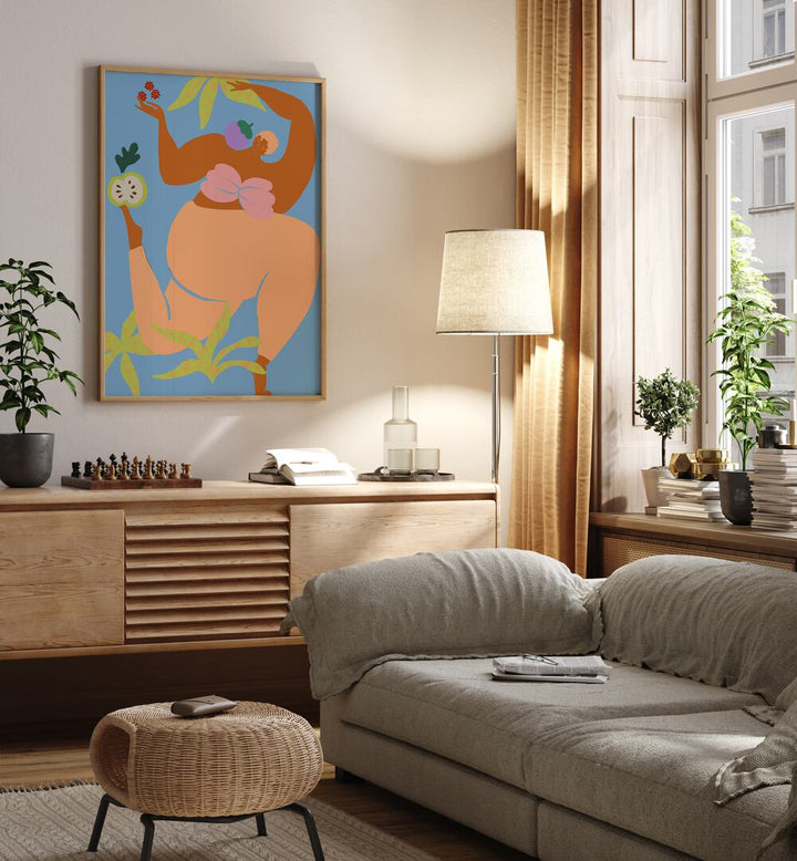 Fruity Run By Arty Guava Wall Art Prints in Oak Wood Plain Frame placed on a Cream Colored Wall above a Console Table near a Grey Sofa  in the Living Room