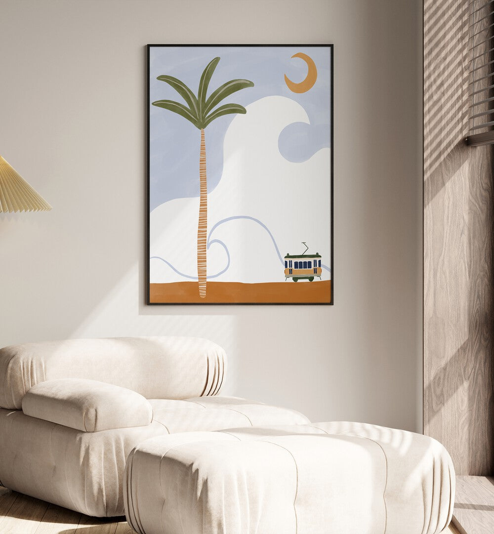 Gaboon By Ivy Green Landscape Art Artwork in Black Plain Frame Placed on a Beige Colored wall near a White Sofa Chair in the Drawing Room