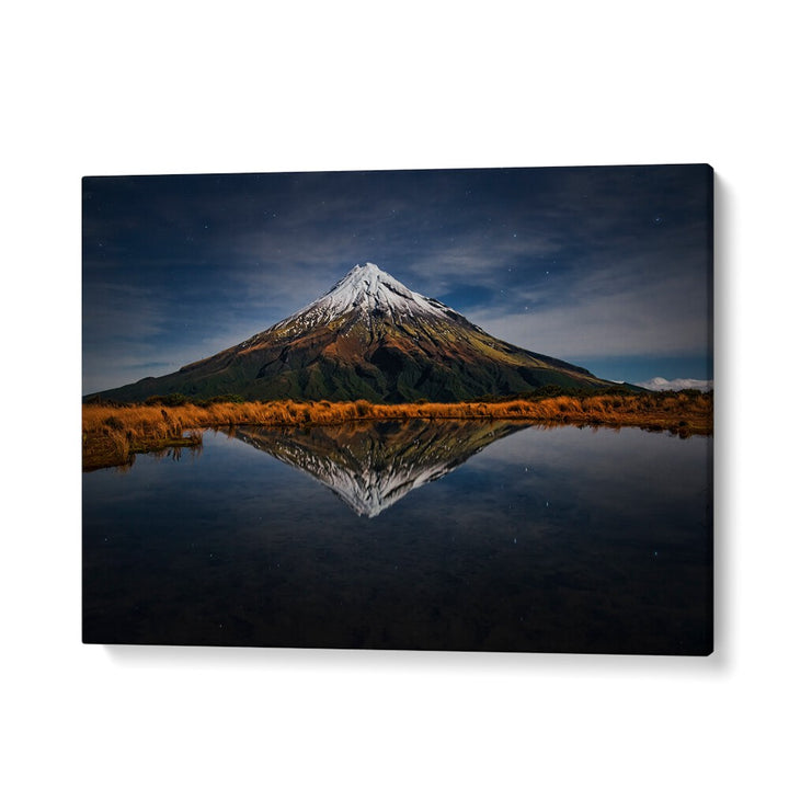 Stunning MOUNT TARANAKI - A STARRY NIGHT, PHOTOGRAPHY PRINTS showing the mountain reflecting under a starry sky.