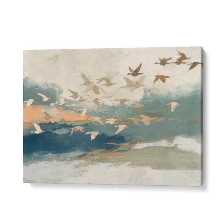 BIRDS IN FLIGHT AT DUSK OVER OPEN WATER