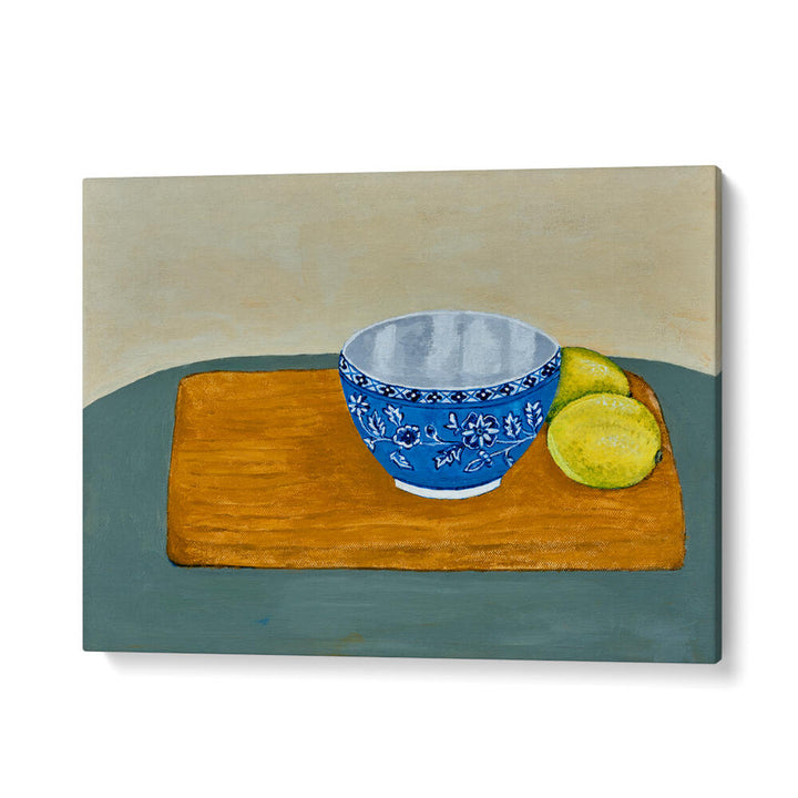Bright blue bowl with two fresh lemons on a wooden surface, perfect for LEMONS, KITCHEN POSTERS decor.