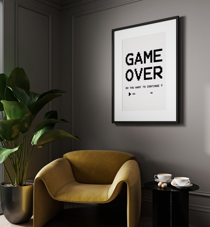 Game Over Continue Gaming Art Painting Artwork in black frame with mount behind a sofa on grey wall