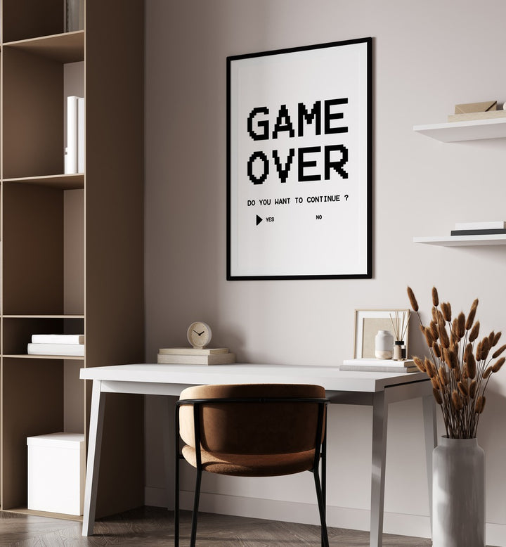 Game Over Continue Gaming Art Painting Artwork in plain black frame above a white table beside a shelf