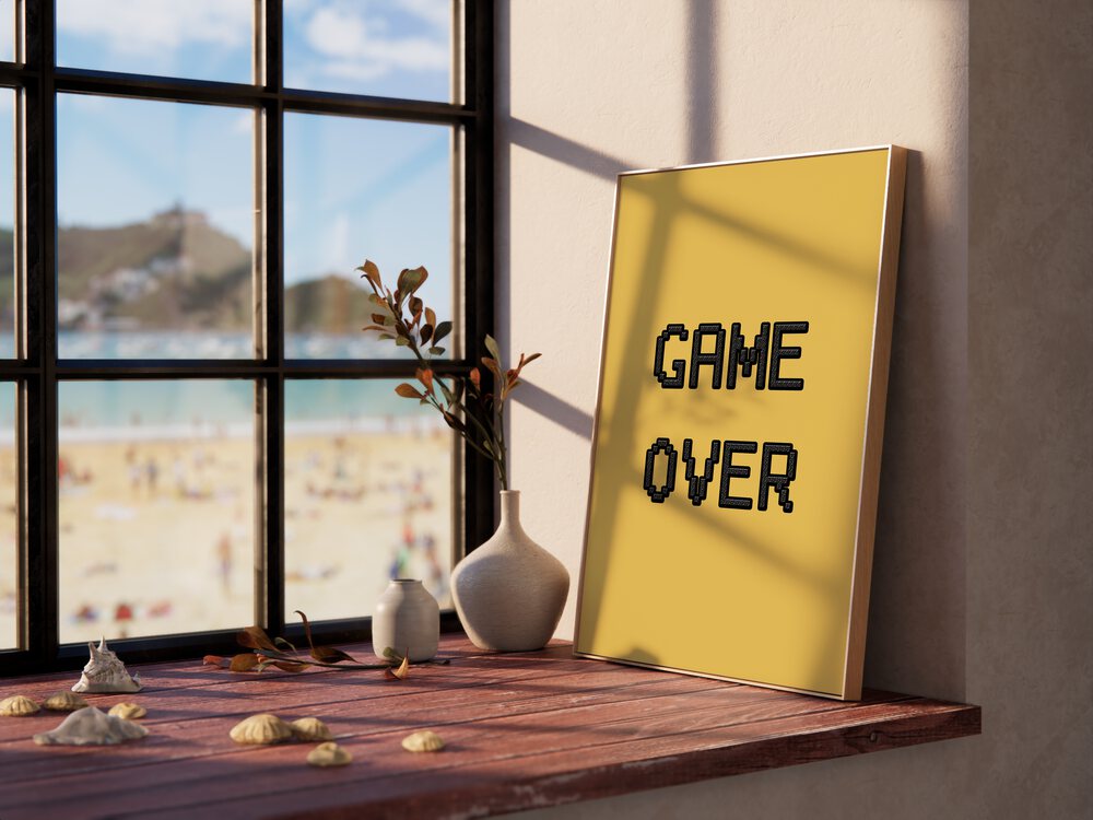 Game Over Gaming Art Painting Artwork in plain oakwood frame beside a window