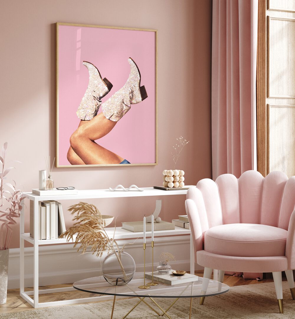 Glitter Boots-pink II Surreal Art Painting Artwork in plain oakwood frame on a pink wall behind a table