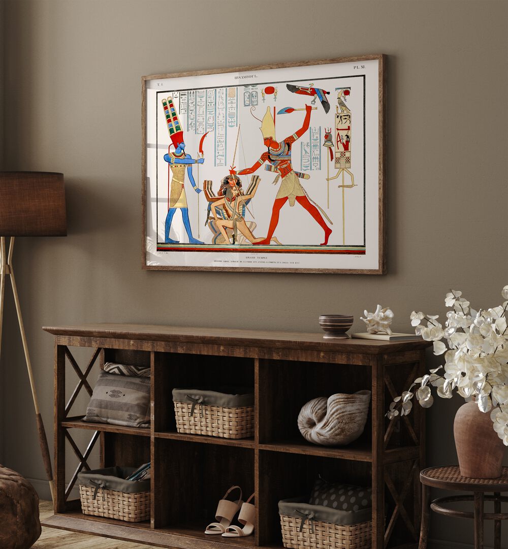 Grand Temple Artwork Egyptian Cultural Art Painting Artwork in plain oakwood frame on a table next to a brown lamp