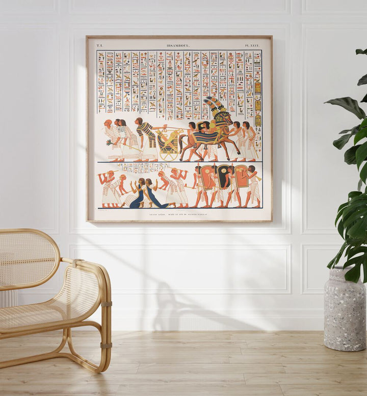 Great Speos Artwork Egyptian Cultural Art Painting Artwork in oakwood plain frame on white wall behind a chair