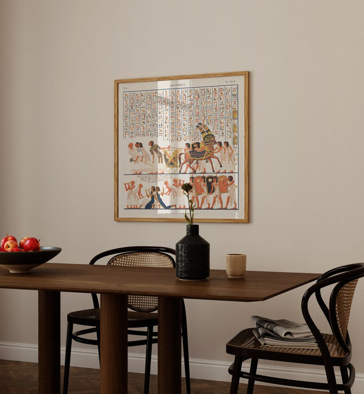 Great Speos Artwork Egyptian Cultural Art Painting Artwork in plain oakwood frame behind dining table for dining area