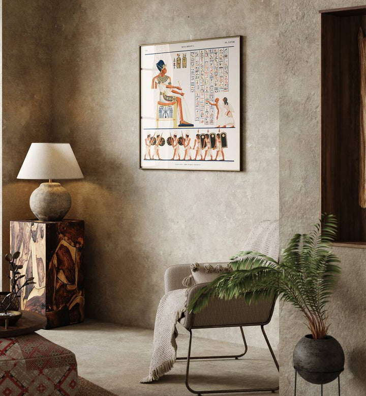 Great Speos North Wall Artwork Egyptian Cultural Art Painting Artwork in plain oakwood frame in beige colour wall next to a lamp