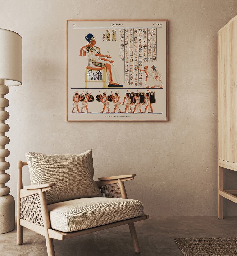 Great Speos North Wall Artwork Egyptian Cultural Art Painting Artwork in oakwood floater frame behind a chair on a beige color wall