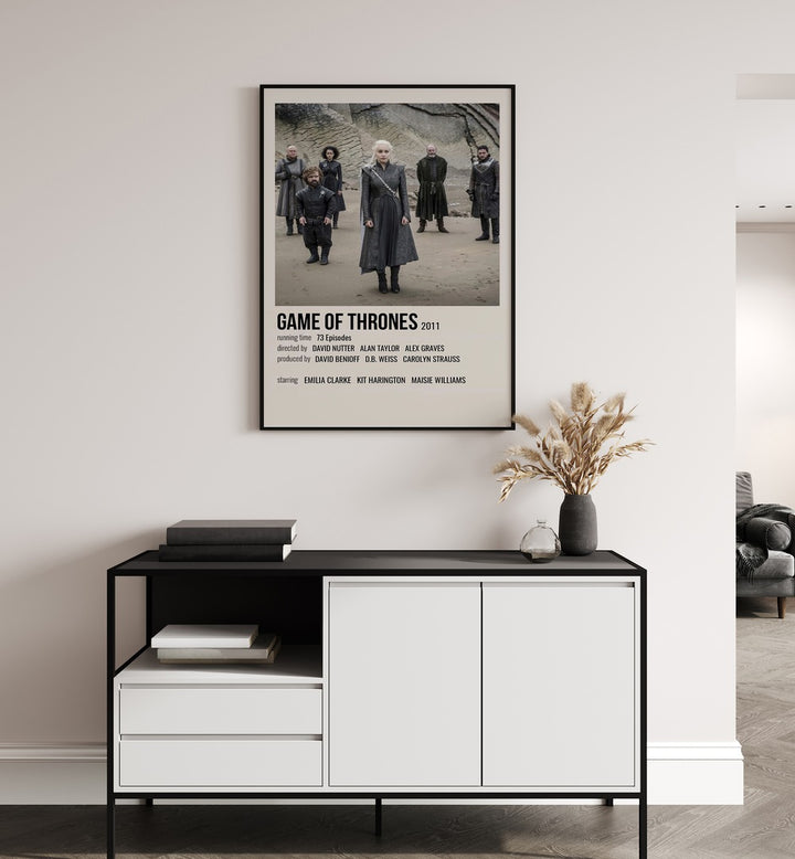 Game Of Thrones 2011 I Movie Posters in Black Plain Frame placed on a white wall behind a black and white table