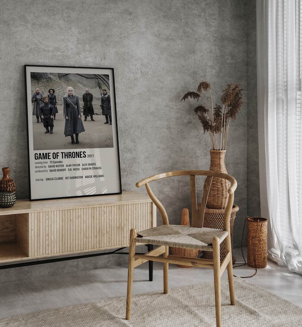 Game Of Thrones 2011 I Movie Posters in Black Plain Frame placed on a console behind a chair