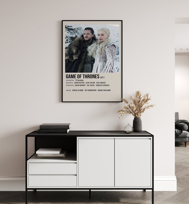 Game Of Thrones 2011 II Movie Posters in Black Plain Frame placed on a white wall behind a black and white table
