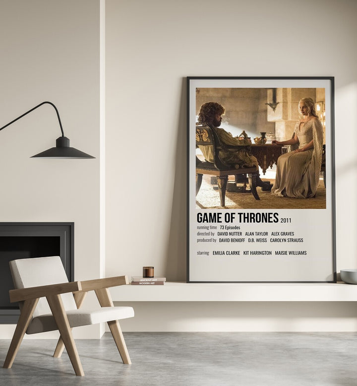 Game Of Thrones 2011 III Movie Posters in Black Plain Frame placed on a shelf beside a hearth