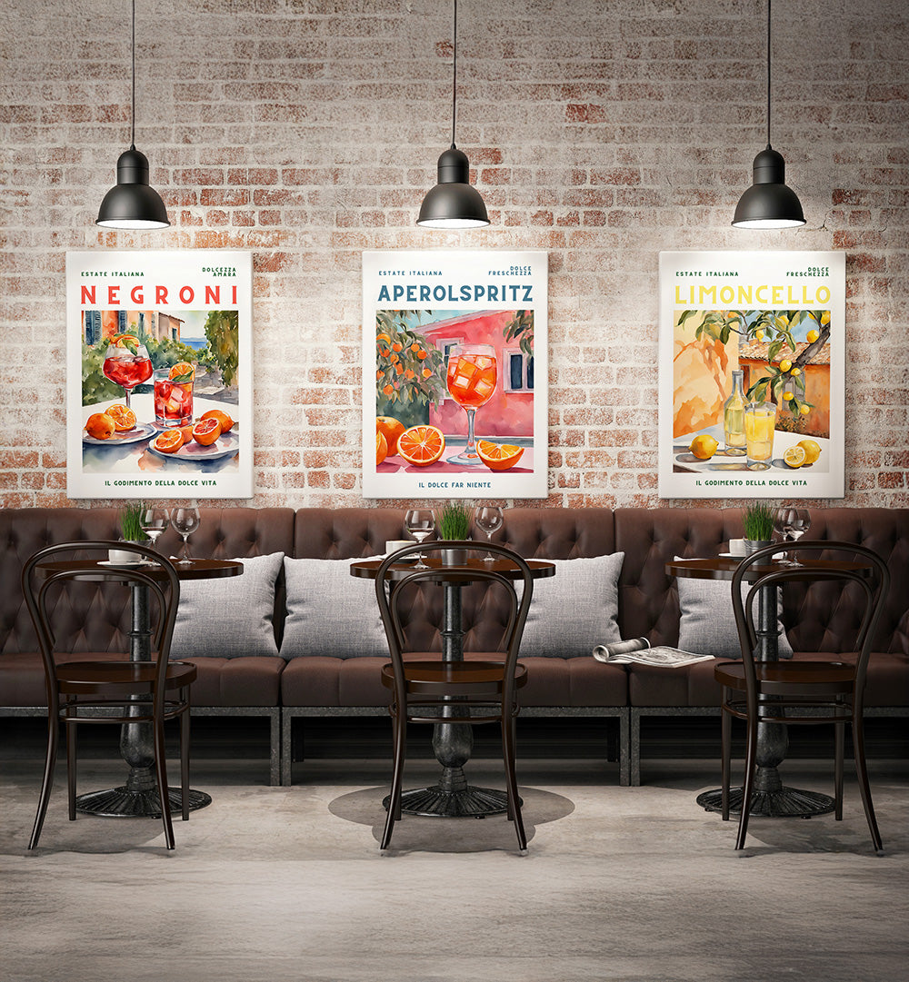 Café interior with three cocktail-themed posters on a brick wall.