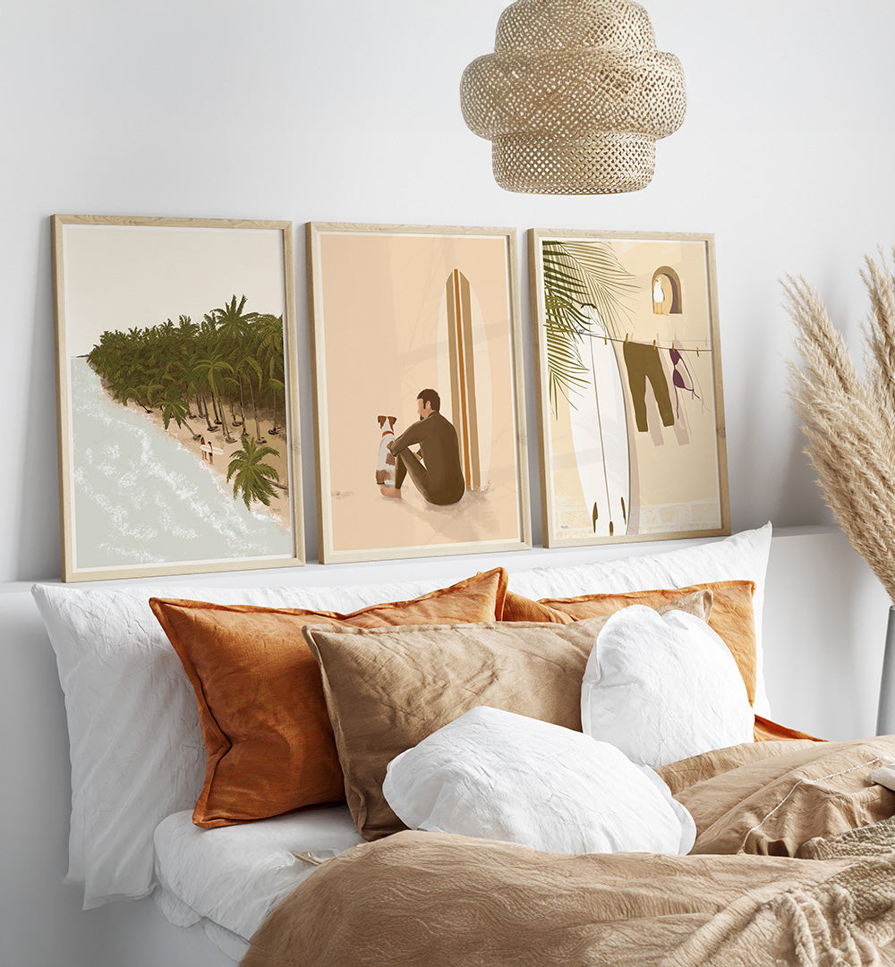 Decorative pillows on a sofa with framed artwork and a woven lamp in the background.