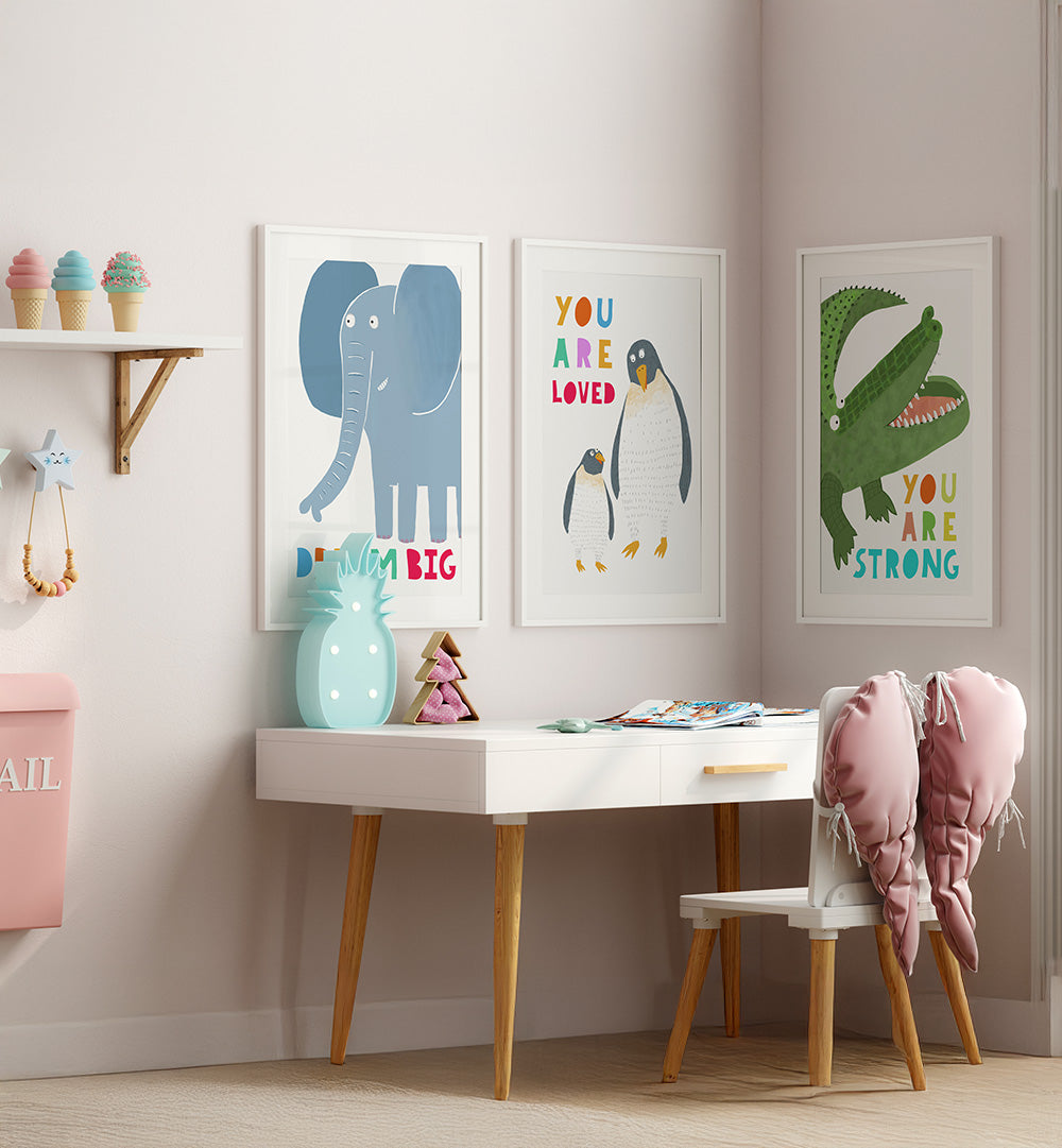 Children's room with a desk, chair, and wall art featuring animals and motivational phrases.